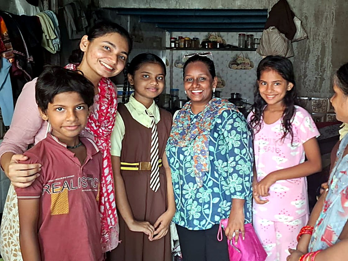 A Touching Lives home visit with children and mentors