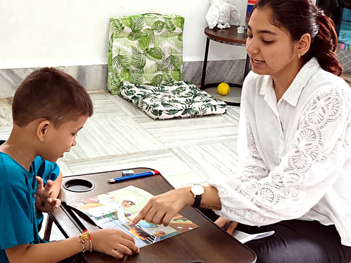 A mentor working one-to-one with a child at Touching Lives