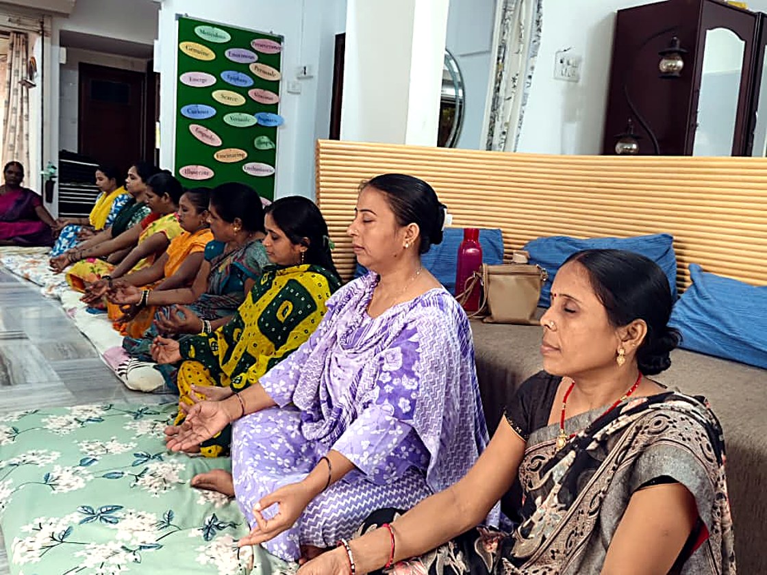 Mothers in a healing and meditation circle at Touching Lives